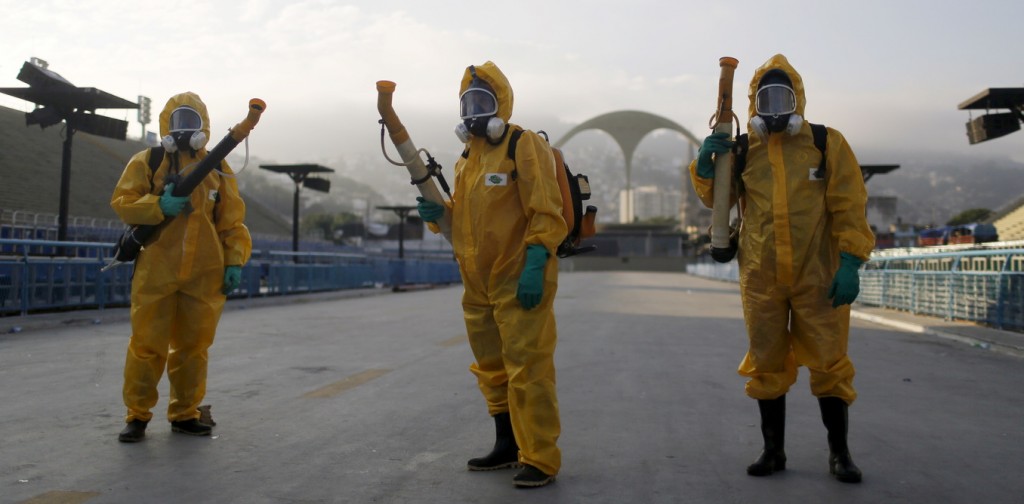 Municipal workers wait before spraying insecticide at Sambodrome in Rio de Janeiro, Brazil, January 26, 2016. Municipal workers sprayed insecticide around Sambadrome, where the city's Carnival takes place every year, and where the archery competitions will take place during the Rio Olympics. The operation is part of the city's effort to prevent the spread of Zika's vector, the Aedes aegypti mosquito, according to a statement from Municipal Health Secretary. REUTERS/Pilar Olivares - RTX2423J
