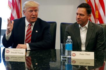 FILE PHOTO: U.S. President-elect Donald Trump sits with PayPal co-founder and Facebook board member Peter Thiel, during a meeting with technology leaders at Trump Tower in New York