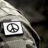 Peace sign on military uniform. The Peace symbol. Peace and war.