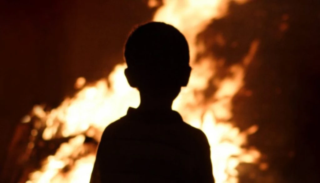 Child watching the fire