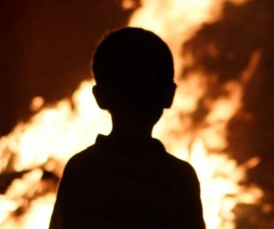 Child watching the fire
