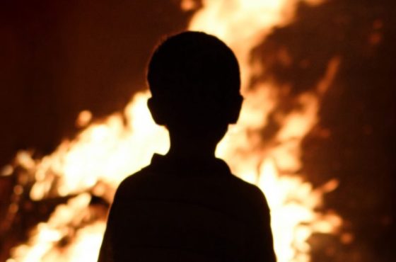 Child watching the fire