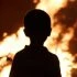 Child watching the fire