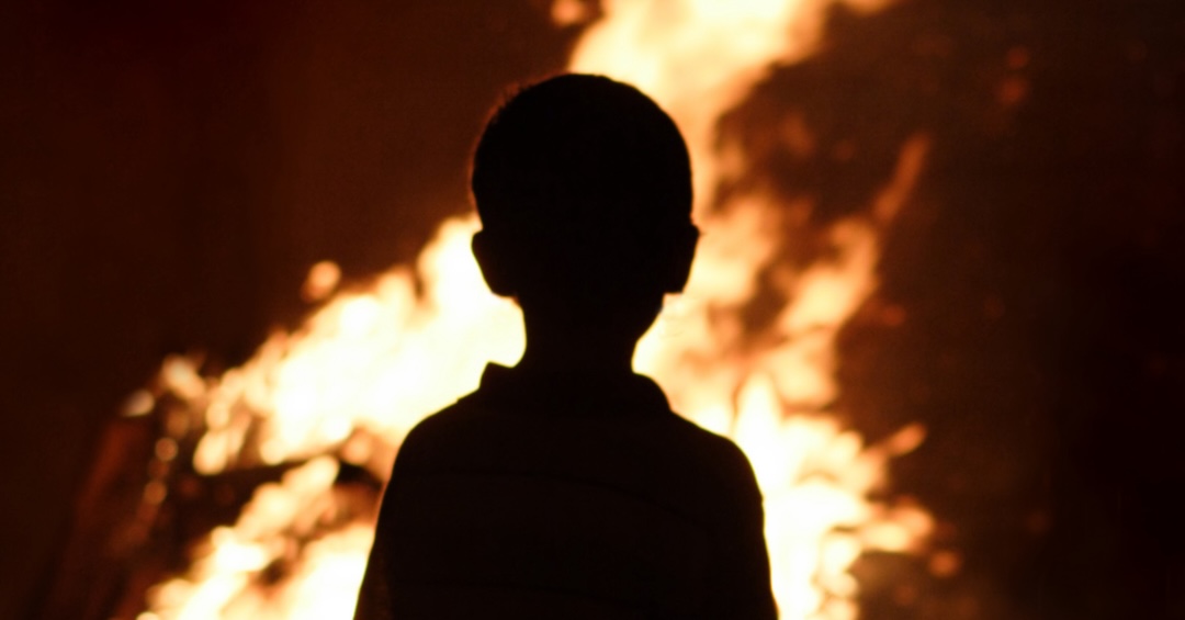 Child watching the fire
