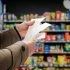 Minded,Man,Viewing,Receipts,In,Supermarket,And,Tracking,Prices