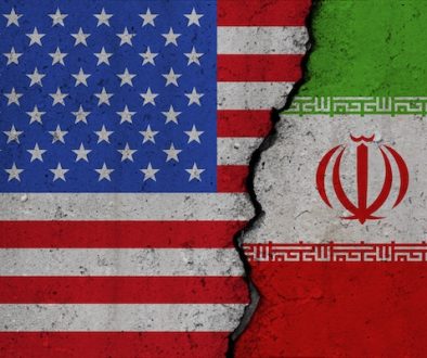 Us,And,Iran,Flags,On,Broken,Concrete