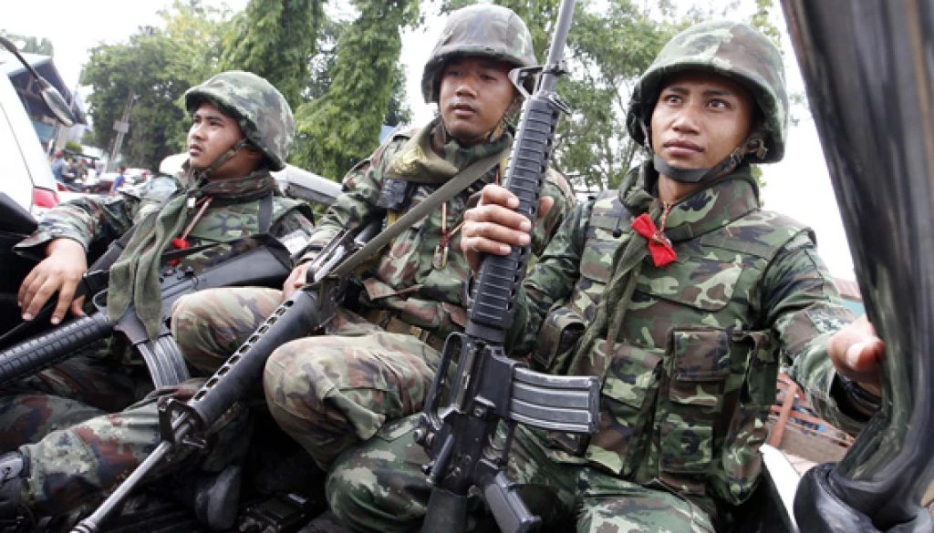 Thai soldiers are seen during a visit by Thai Prime Minister Abhisit Vejjajiva in Surin province