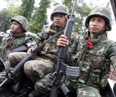 Thai soldiers are seen during a visit by Thai Prime Minister Abhisit Vejjajiva in Surin province