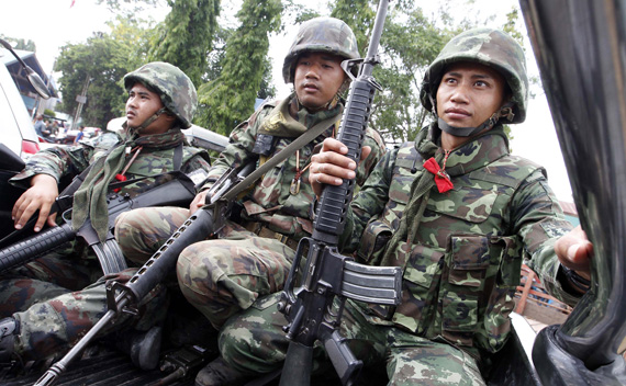 Thai soldiers are seen during a visit by Thai Prime Minister Abhisit Vejjajiva in Surin province