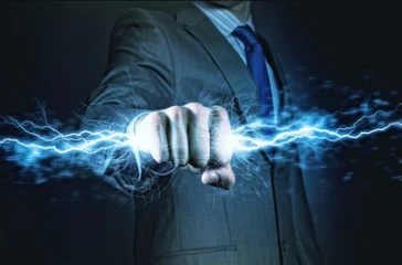 Businessman,Holding,Lightning,In,Fist.,Power,And,Control