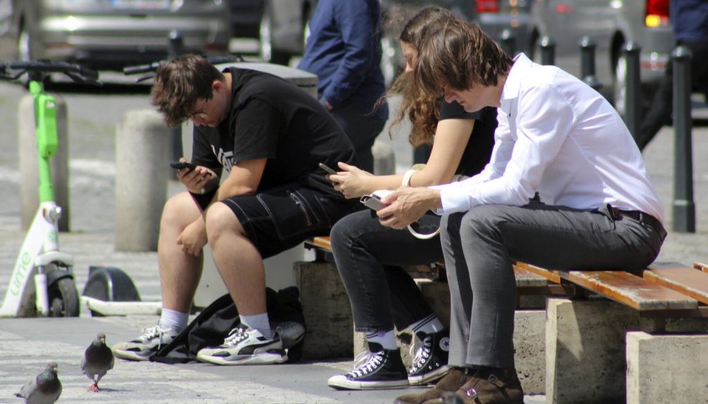 young people, addicted to smartphones, mobile, Wenceslas Square, city center Prague
