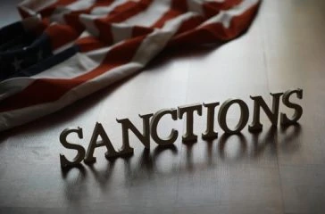 Economic,Sanctions,Concept,With,American,Flag,Background