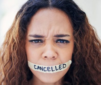 Woman, portrait and tape on mouth for violence with political, protest and feminism movement for justice. Activism, victim and person with censor and cancel culture, harassment and freedom of speech