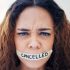Woman, portrait and tape on mouth for violence with political, protest and feminism movement for justice. Activism, victim and person with censor and cancel culture, harassment and freedom of speech