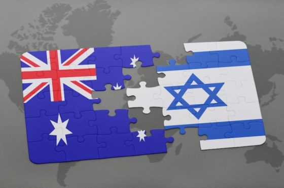puzzle with the national flag of australia and israel on a world map background. puzzle with the national flag of australia and israel on a world map background.
