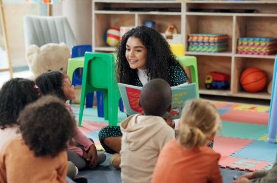 Reading, education and teacher with children in classroom for learning, books and students. Growth, kindergarten and academy with woman and kids at school for youth, story time and child development Reading, education and teacher with children in classroom for learning, books and students. Growth, kindergarten and academy with woman and kids at school for youth, story time and child development