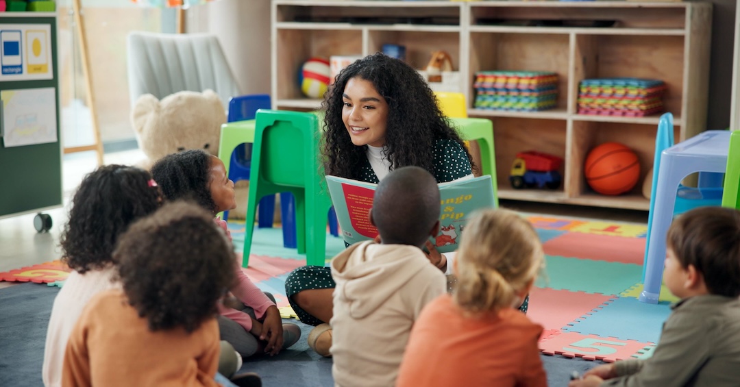 Reading, education and teacher with children in classroom for learning, books and students. Growth, kindergarten and academy with woman and kids at school for youth, story time and child development Reading, education and teacher with children in classroom for learning, books and students. Growth, kindergarten and academy with woman and kids at school for youth, story time and child development