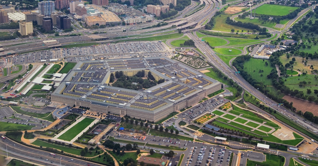 Aerial view of the United States Pentagon, the Department of Defense headquarters in Arlington, Virginia, near Washington DC, with I-395 freeway and the Air Force Memorial and Arlington Cemetery nearb Aerial view of the United States Pentagon, the Department of Defense headquarters in Arlington, Virginia, near Washington DC, with I-395 freeway and the Air Force Memorial and Arlington Cemetery nearb