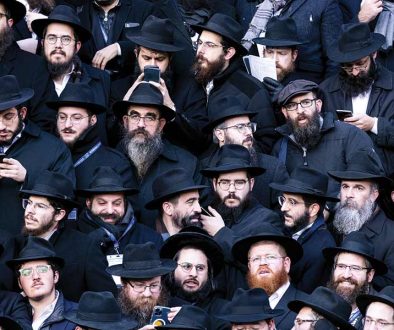 rabbis-pose-for-a-group-photo-in-front-of-Chabad-Lubavitch-world-headquarters