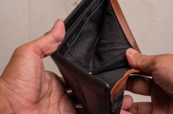A,Close-up,Of,An,Empty,Wallet,Held,By,A,Person's