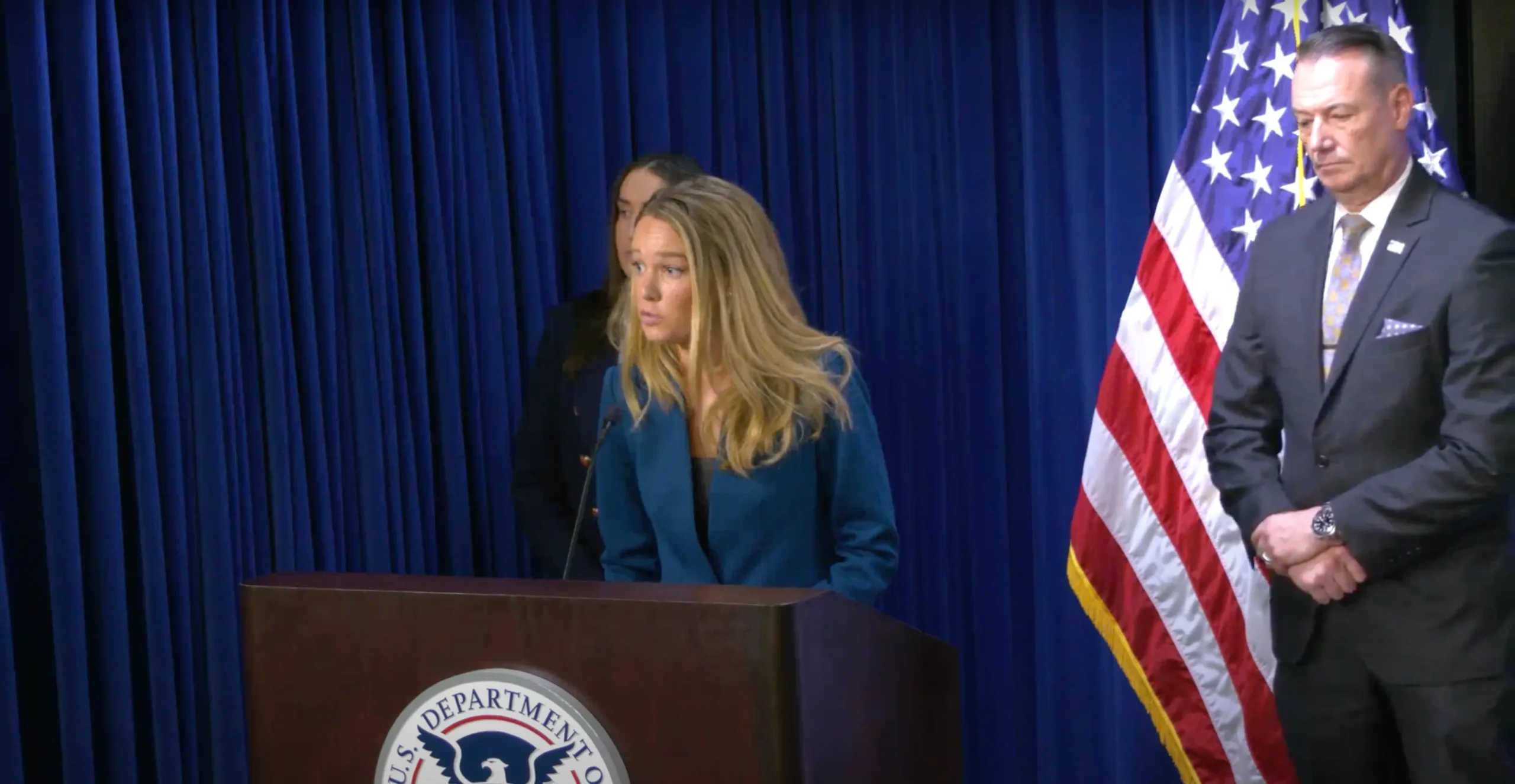 tricia-mclaughlin-at-a-podium (1)