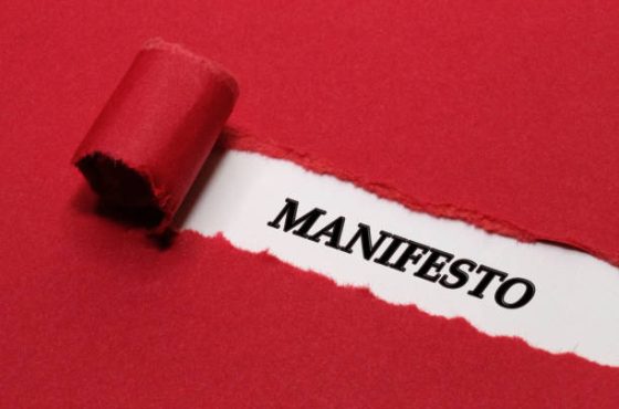 Manifesto Written Under Red Torn Paper