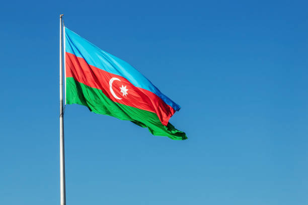 Azerbaijan flag on blue sky background.