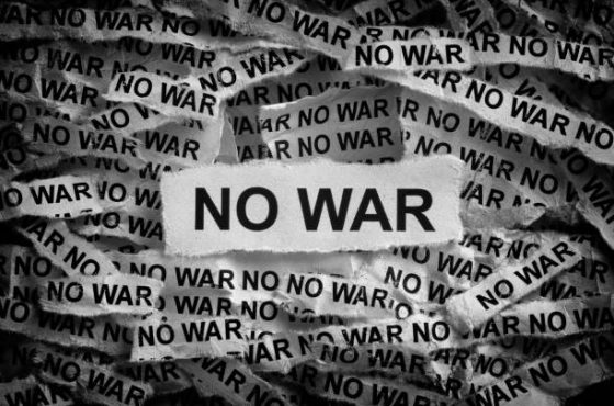 Strips of newspaper with the words No War. Black and white. Close up.