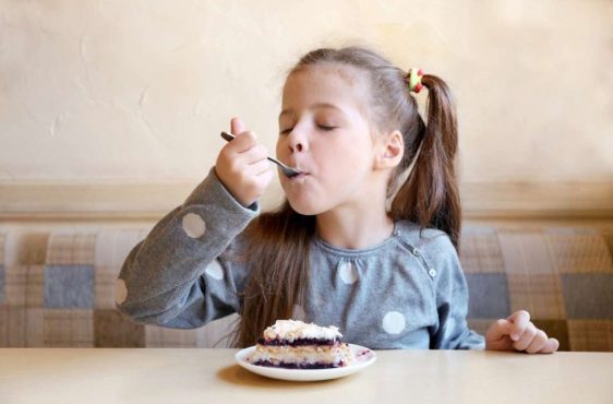 adobestock-girl-eating-cake