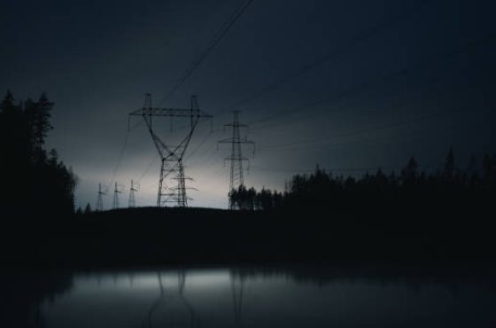 High voltage electric line at night. Electricity supply subject