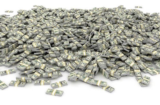 Large pile of cash - US dollars on white background