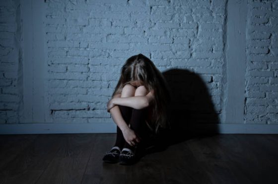 Sad desperate young girl suffering from bulling and harassment at school