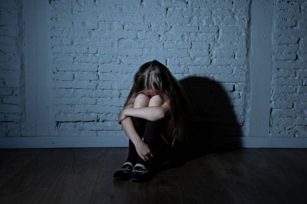 Sad desperate young girl suffering from bulling and harassment at school Sad desperate young girl suffering from bulling and harassment at school